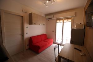 Televízia a/alebo spoločenská miestnosť v ubytovaní Holiday House Alba
