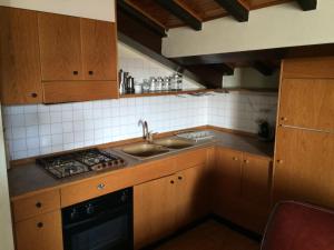 A kitchen or kitchenette at Casa Mario Lupo - Apartments and Rooms