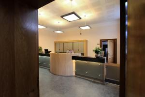 an office with a reception desk and a lobby at Abdij Hotel Rolduc in Kerkrade