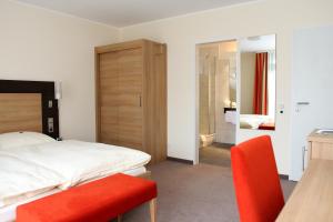 Postel nebo postele na pokoji v ubytování Hotel Wiehen-Therme