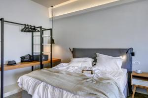 Voodi või voodid majutusasutuse Naves Suites toas