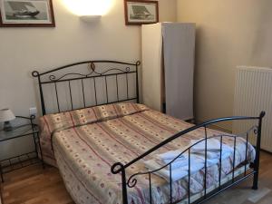 Кровать или кровати в номере Au Bon Laboureur