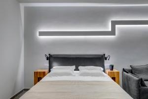 Voodi või voodid majutusasutuse Naves Suites toas