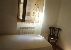 Postel nebo postele na pokoji v ubytování Casa lo Sastre - Jasa