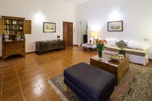 A seating area at At Kalsa Quiet Flowered Terrace! Free Parking! Ideal for remote working!