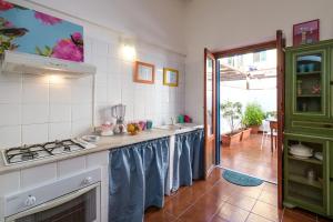 A kitchen or kitchenette at At Kalsa Quiet Flowered Terrace! Free Parking! Ideal for remote working!
