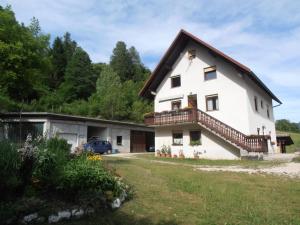 a large white house with a balcony at Apartment Vida in Bovec