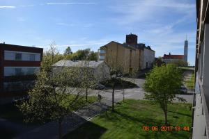 a view of a street with trees and buildings at City Apartment Kauppakatu with Sauna in Iisalmi