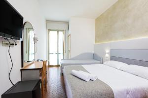 Postel nebo postele na pokoji v ubytování Hotel Albatros