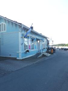 a blue building on the side of a street at Sininen Talo in Naantali