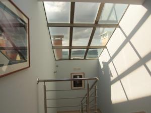 a view from the top of a staircase with windows at Hotel O Noso Portosin in Portosin