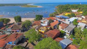an aerial view of a town with a beach at O Pharol Hostel e Pousada in Itacaré