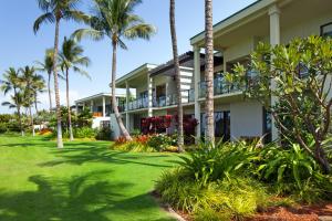 a building with palm trees in front of it at Andaz Maui at Wailea Resort - A Concept by Hyatt in Wailea