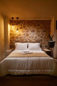 Posteľ alebo postele v izbe v ubytovaní warm stone house