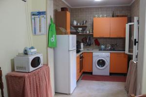 a kitchen with a refrigerator and a microwave at Casa Assuntina in Acaya