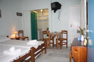 Postel nebo postele na pokoji v ubytování Studios Naxos