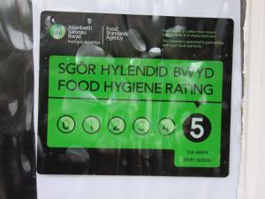 a sign for a food hygiene rating on a machine at West Point Hotel Bed and Breakfast in Colwyn Bay