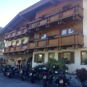 a group of motorcycles parked in front of a building at Landhaus Engadin in Nauders