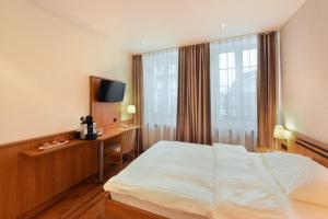 Apart Hotel Amadeo客房内的一张或多张床位