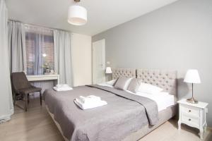 Ένα ή περισσότερα κρεβάτια σε δωμάτιο στο Marine Rooms