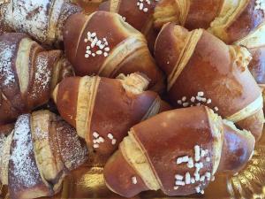 a pile of chocolate covered pastries on a plate at Aparthotel Villa Marinù in Ischia