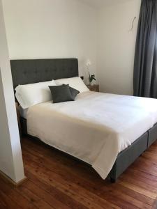 A bed or beds in a room at Corte di Pellio