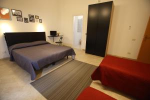 Letto o letti in una camera di Dimora Hostel