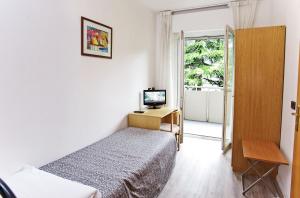 Rúm í herbergi á Hotel Rubino