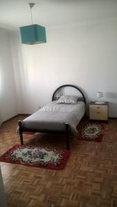 En eller flere senge i et værelse på Casa de Campo São Bernardo
