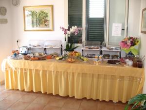 a table with food on it in a room at Residence Maresol in Vieste