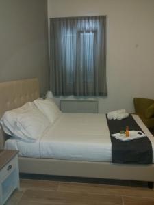 A bed or beds in a room at B&B Emozioni e Relax