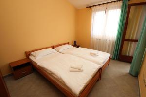 Postel nebo postele na pokoji v ubytování Villa Viktoria + 11 fotografií