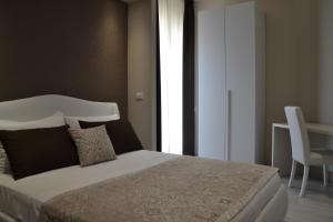 Postel nebo postele na pokoji v ubytování B&B Terra d'Oriente