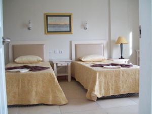 Postel nebo postele na pokoji v ubytování Hotel Vanilla