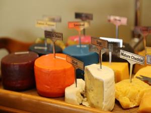 a bunch of different types of cheese on a table at Skeiding Guest Farm in Heidelberg