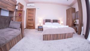 Postel nebo postele na pokoji v ubytování Hotel Semitronix