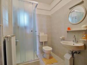 a bathroom with a shower and a toilet and a sink at Apartments Panorama view Zeljko Scerbe in Rab +84 photos