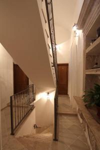 a hallway with a staircase with lights in a building at Villa Violić in Zaton