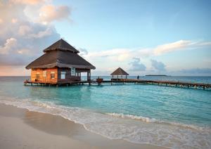 a house on a pier in the water at Adaaran Club Rannalhi - All Inclusive - 45 Minutes away from Male by Speedboat in South Male Atoll