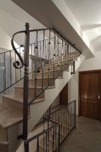a stairway with a metal railing and a stair case at Villa Violić in Zaton