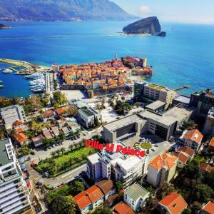 an aerial view of a city next to the ocean at Apartments M Palace in Budva