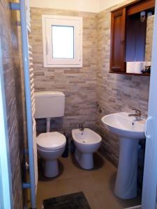a bathroom with a toilet and a sink at Casa Elsa in Biassa +15 photos