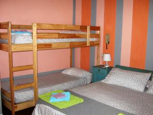 a bunk bed room with two beds and a ladder at Albergo Sangalli in Boario Terme