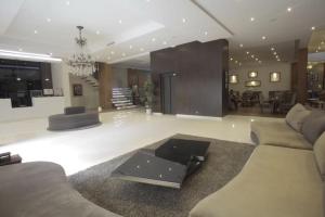 a living room with a couch and a coffee table at The Seven Hotel in Casablanca