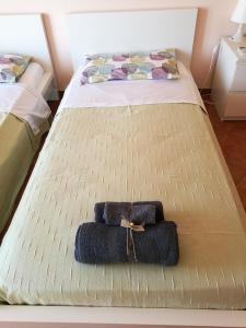 Ένα ή περισσότερα κρεβάτια σε δωμάτιο στο A Casa di Ida