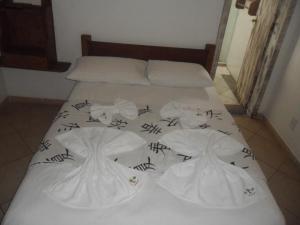 Cama ou camas em um quarto em Pousada La Lampara