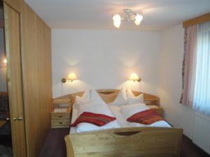 Postel nebo postele na pokoji v ubytování Pension & Appartement Steinwender