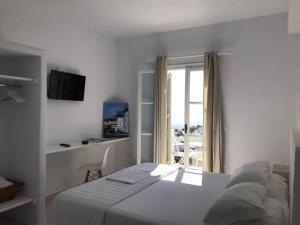 Cama ou camas em um quarto em Paolas Sunset