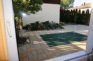 a view of a patio from a door at Domek przy plaży in Rewa