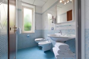 a bathroom with a sink and a toilet at Hotel La Meridiana in Sorrento